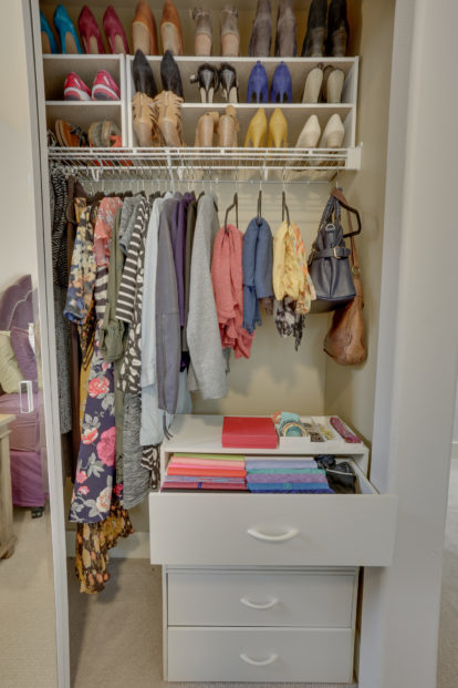 A professionally unpacked and organized bedroom closet by ReSPACEd Portland Professional Home & Business Organizer Services