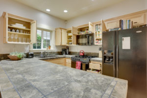 A professionally organized kitchen with organized cabinets by ReSPACEd Portland Professional Home & Business Organizer Services