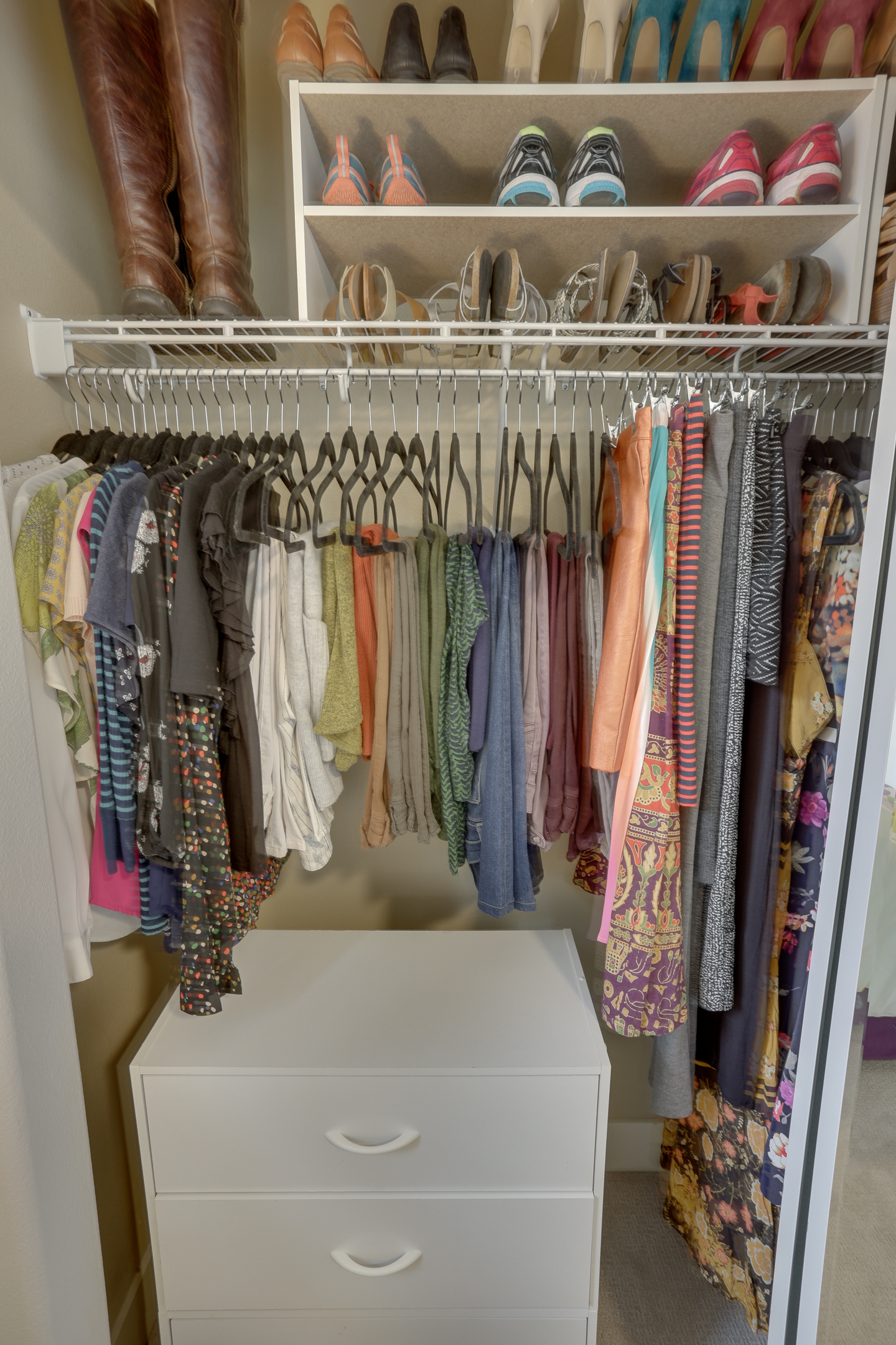 An organized bedroom closet by ReSPACEd Professional Organizing in Portland